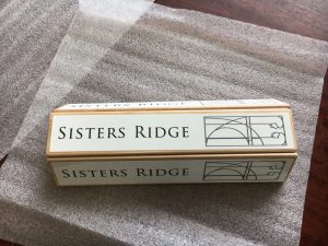 Sisters Ridge tap handle decals on a tap handle.