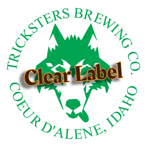 Tricksters Brewing Co. Idaho clear promotional label with green printing.